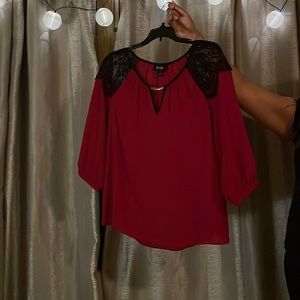 This blouse is a beautiful red color. Super comfortable yet fancy!